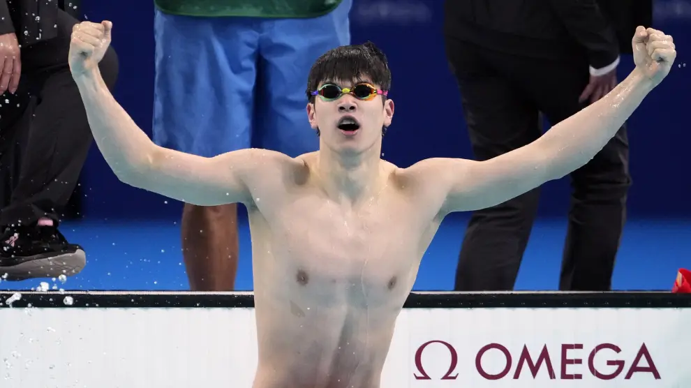 Pan Zhanle, of China, celebrates after winning the men's 100-meter freestyle final at the 2024 Summer Olympics, Wednesday, July 31, 2024, in Nanterre, France. (AP Photo/Matthias Schrader)