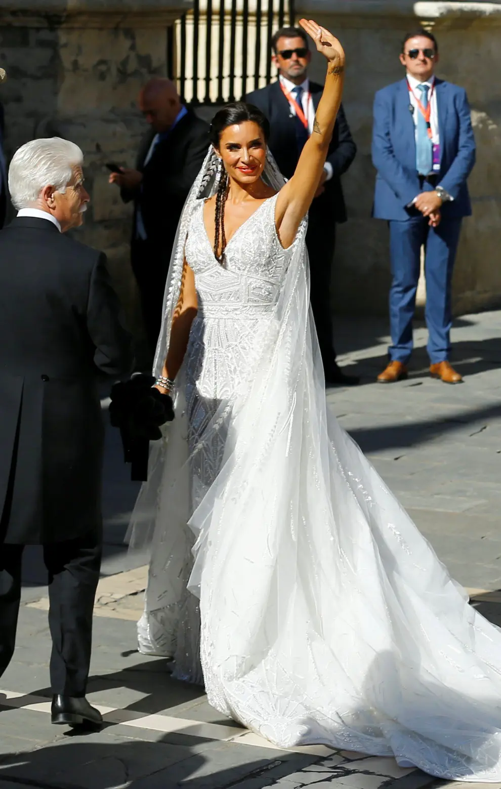Real Madrid captain Sergio Ramos's fiancee Pilar Rubio blows a kiss next to her father Manuel Rubio at her wedding at the cathedral in Seville, Spain June 15, 2019. REUTERS/Marcelo del Pozo [[[REUTERS VOCENTO]]] SOCCER-SPAIN/RAMOS-WEDDING