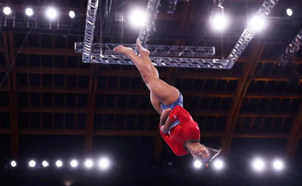 Tokyo 2020 Olympics - Gymnastics - Artistic - Womens Team - Final - Ariake Gymnastics Centre, Tokyo, Japan - July 27, 2021.  Jordan Chiles of the United States bumps fists with the coach after performing on the vault. REUTERS/Lindsey Wasson[[[REUTERS VOCENTO]]] OLYMPICS-2020-GAR/W-TEAM-FNL