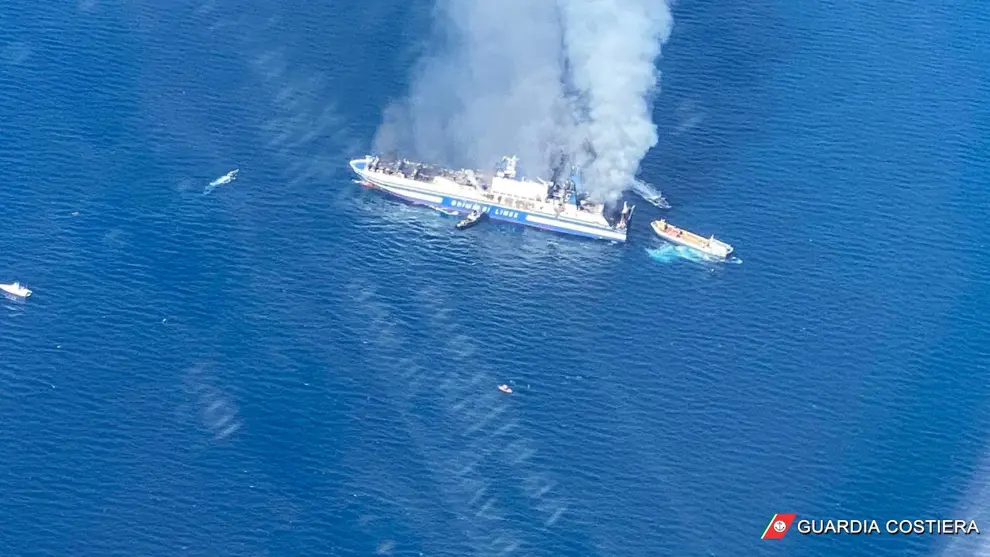 The Italian-flagged Grimaldi Euroferry Olympia, that caught fire off the island of Corfu, is seen from the Guardia di Finanza vessel, Greece, February 18, 2022. In this screengrab taken from video. Guardia di Finanza Press Office/Handout via REUTERS ATTENTION EDITORS - THIS IMAGE HAS BEEN SUPPLIED BY A THIRD PARTY. NO RESALES. NO ARCHIVES GREECE-FERRY/FIRE