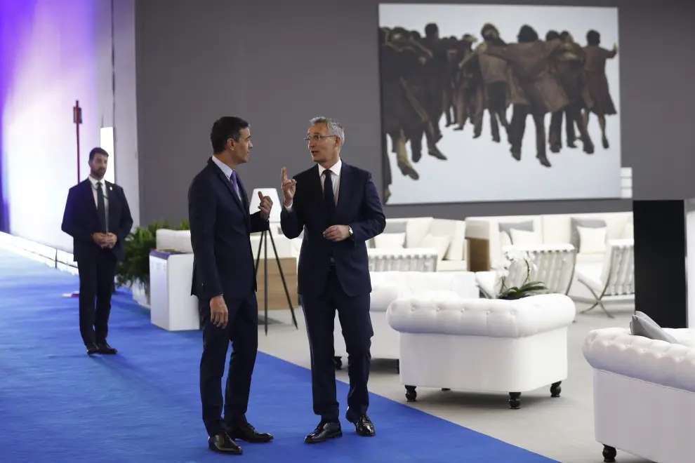 NATO Secretary General Jens Stoltenberg chats with Spanish Prime Minister Pedro Sanchez as they arrive at the NATO summit venue in Madrid, Spain June 28, 2022. REUTERS/Yves Herman NATO-SUMMIT/
