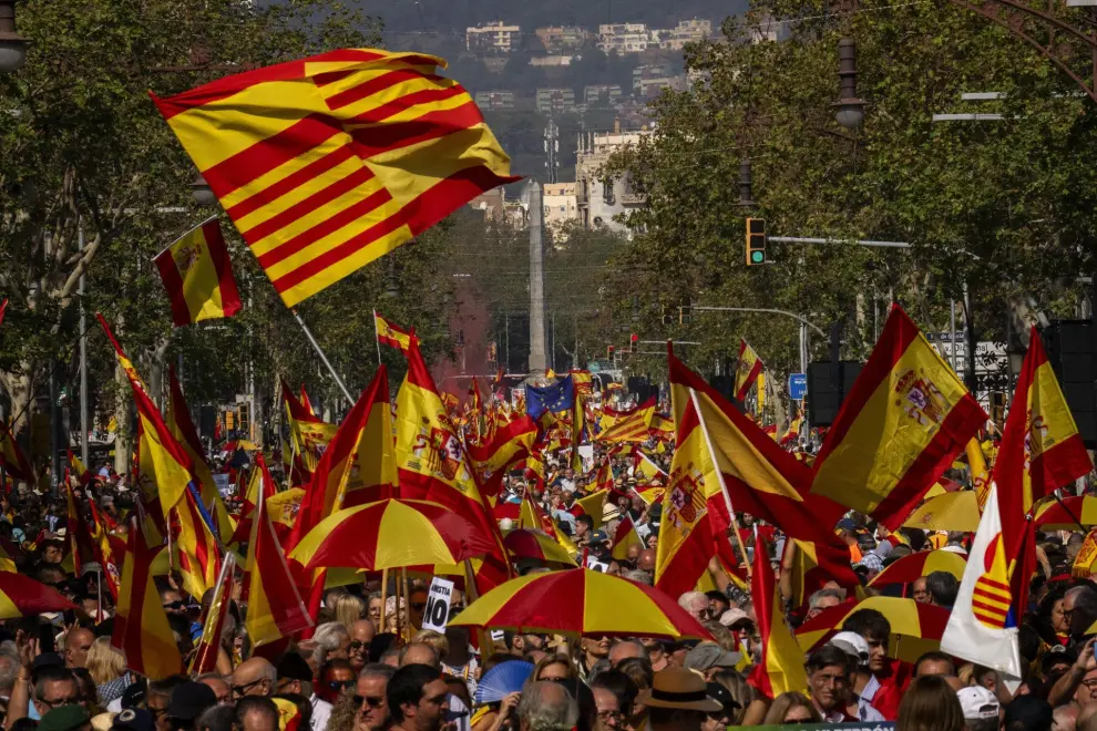Demonstrators march during a protest organized by Sociedad Civil Catalana in Barcelona Spain, Sunday, Oct. 8, 2023. Thousands protest against the possibility of Spain's left-wing government proposing an amnesty for hundreds of people in legal trouble for involvement in Catalonia's separatist movement. (AP Photo/Emilio Morenatti)