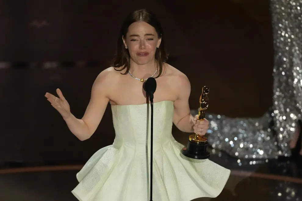 Emma Stone accepts the award for best performance by an actress in a leading role for "Poor Things" during the Oscars on Sunday, March 10, 2024, at the Dolby Theatre in Los Angeles. (AP Photo/Chris Pizzello)
