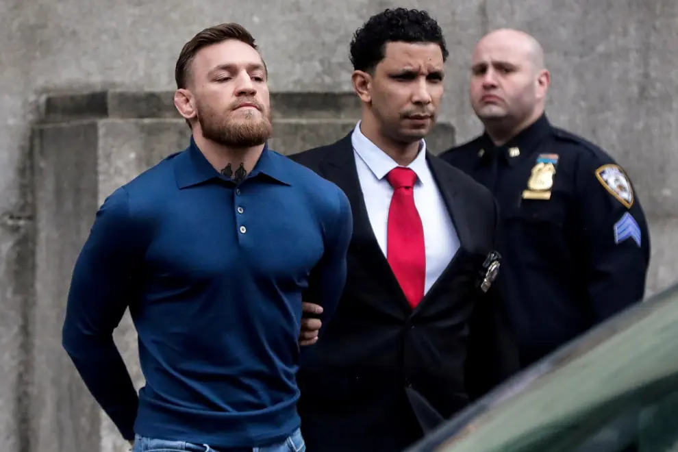 FILE PHOTO: Mixed martial arts (MMA) fighter Conor McGregor exits the courtroom after appearing in the Brooklyn court on charges of assault stemming from a melee, in the Brooklyn borough of New York City, U.S., July 26, 2018. REUTERS/Eduardo Munoz/File Photo [[[REUTERS VOCENTO]]] MMA-MCGREGOR/RETIREMENT