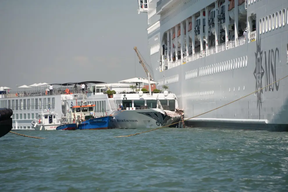 Venice (Italy), 02/06/2019.- The cruise ship MSC Opera (R) is seen after the collision with a tourist boat, in Venice, Italy, 02 June 2019. The cruise ship smashed into a dock located on the Giudecca canal in Venice this morning. Tugs could not maintain control of the MSC cruise ship as it struck the dock and then struck the stern of the 'River Countess' tourist boat (L) which was docked. Four people were taken to the hospital, according to reports. (Italia, Niza, Venecia) EFE/EPA/ANDREA MEROLA Cruise ship collides with tourist boat in Venice