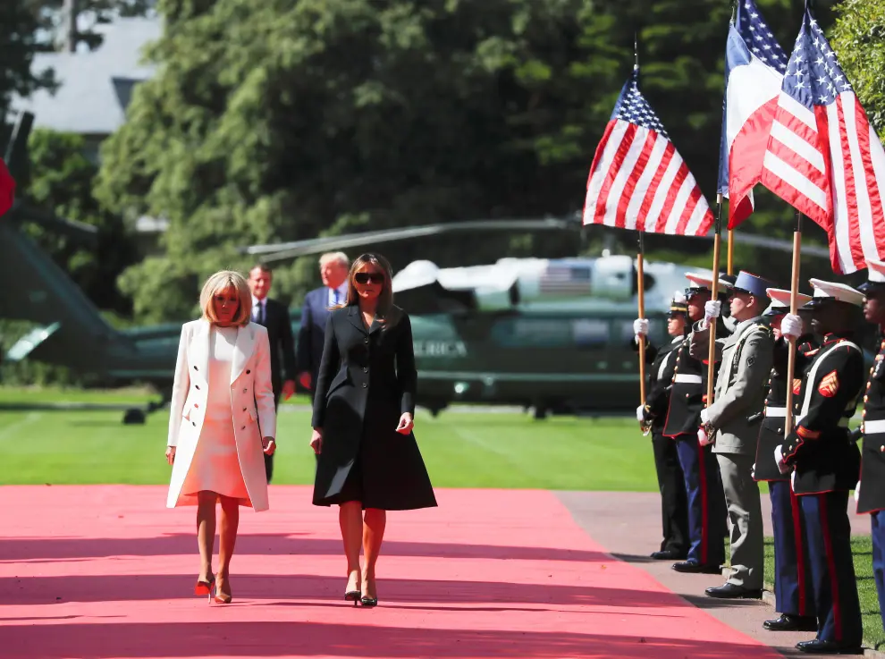 U.S President Donald Trump and French President Emmanuel Macron attend a French-American commemoration ceremony for the 75th anniversary of D-Day at the American cemetery of Colleville-sur-Mer in Normandy, France, June 6, 2019. [[[REUTERS VOCENTO]]] DDAY-ANNIVERSARY/USA-TRUMP-MACRON
