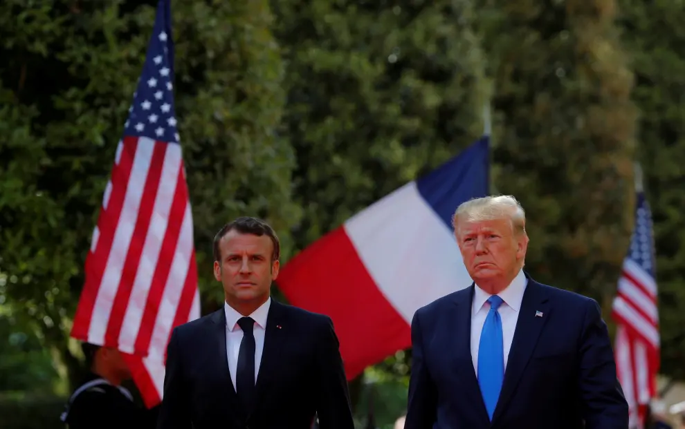 Brigitte Macron and First Lady Melania Trump attend a French-American commemoration ceremony for the 75th anniversary of D-Day at the American cemetery of Colleville-sur-Mer in Normandy, France, June 6, 2019.  REUTERS/Carlos Barria [[[REUTERS VOCENTO]]] DDAY-ANNIVERSARY/USA-TRUMP-MACRON
