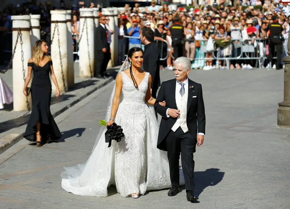 Real Madrid captain Sergio Ramos walks with his mother Paqui Garcia at his wedding with Pilar Rubio at the cathedral in Seville, Spain June 15, 2019. REUTERS/Marcelo del Pozo [[[REUTERS VOCENTO]]] SOCCER-SPAIN/RAMOS-WEDDING