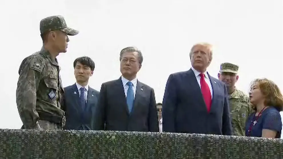 U.S. President Donald Trump and South Korean President Moon Jae-in are seen at the demilitarized zone (DMZ) separating the two Koreas, in Paju, South Korea, June 30, 2019. South Korean Pool/via REUTERS TV       SOUTH KOREA OUT. NO COMMERCIAL OR EDITORIAL SALES IN SOUTH KOREA [[[REUTERS VOCENTO]]] NORTHKOREA-USA/SOUTHKOREA