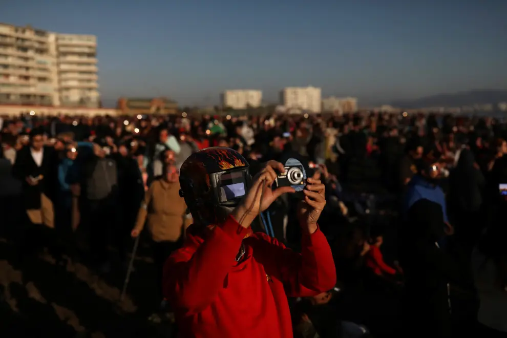 A mas uses a protective mask to observe a solar eclipse at La Serena, Chile, July 2, 2019. REUTERS/Pablo Sanhueza NO RESALES. NO ARCHIVES [[[REUTERS VOCENTO]]] SOLAR-ECLIPSE/CHILE