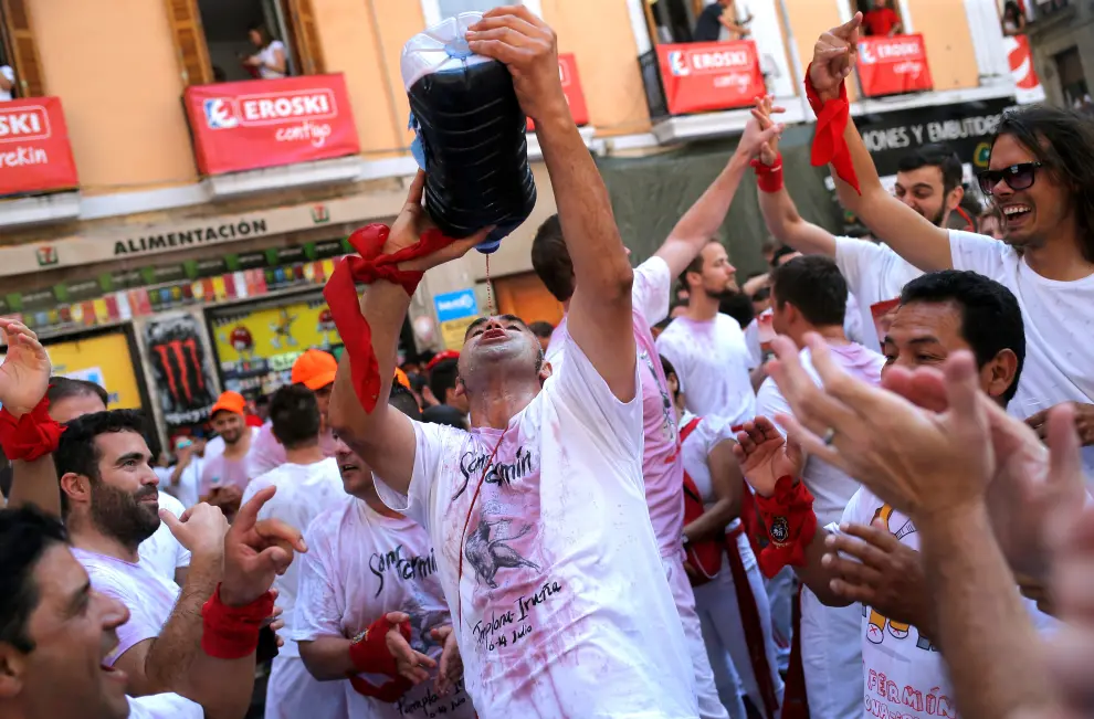 A reveller holds a wineskin before the firing of 'chupinazo', which opens the San Fermin festival in Pamplona Spain, July 6, 2019. REUTERS/Susana Vera [[[REUTERS VOCENTO]]] SPAIN-CULTURE/BULLS-CHUPINAZO
