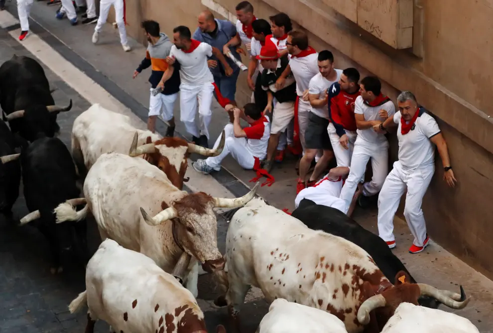 A reveller is carried by medics during the running of the bulls at the San Fermin festival in Pamplona, Spain, July 11, 2019. REUTERS/Jon Nazca [[[REUTERS VOCENTO]]] SPAIN-CULTURE/BULLS