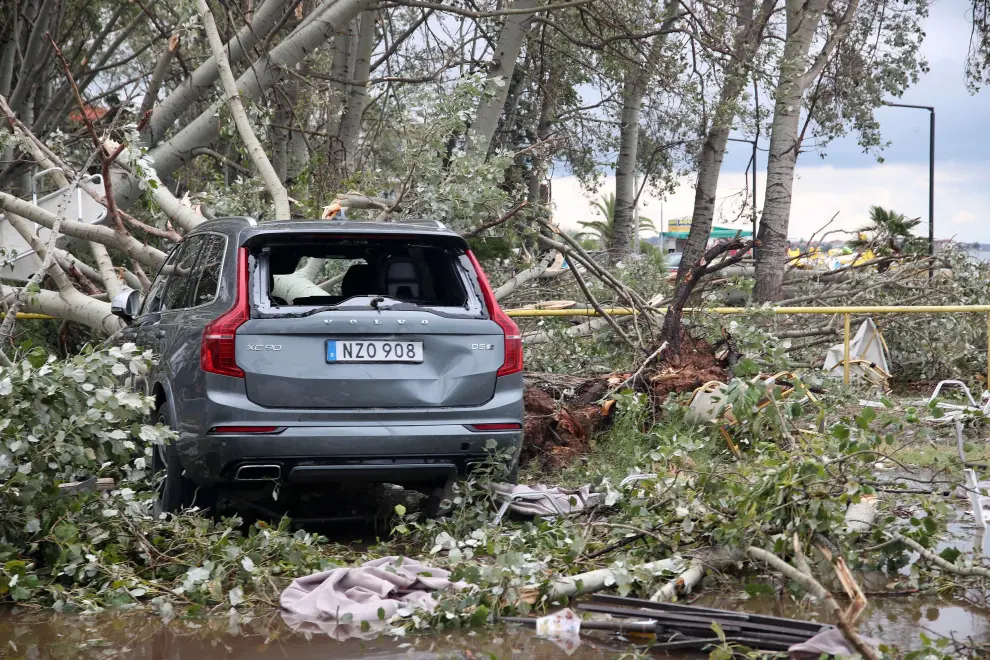 Chalkidiki (Greece), 11/07/2019.- Two employees pull chairs and umbrellas that strong winds and water swept away in Sozopolis, Chalkidiki, northern Greece, 11 July 2019. Six foreign nationals, including two children, were killed after extreme weather conditions that struck Chalkidiki late night of 10 July 2019. (Grecia) EFE/EPA/VERVERIDIS VASSILIS Six people, including two children, were killed after extreme weather conditions that struck Chalkidiki, north Greece