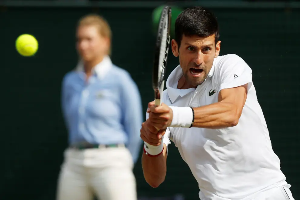 Tennis - Wimbledon - All England Lawn Tennis and Croquet Club, London, Britain - July 14, 2019  Serbia's Novak Djokovic reacts during the final against Switzerland's Roger Federer  REUTERS/Toby Melville [[[REUTERS VOCENTO]]] TENNIS-WIMBLEDON/