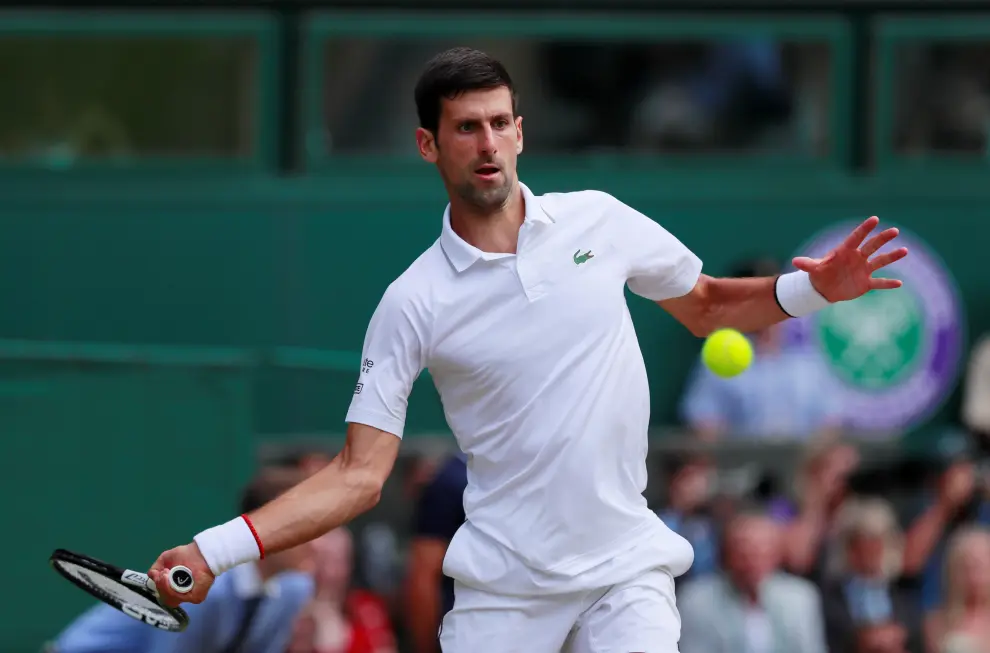 Tennis - Wimbledon - All England Lawn Tennis and Croquet Club, London, Britain - July 14, 2019  Serbia's Novak Djokovic in action during the final against Switzerland's Roger Federer   Adrian Dennis/Pool via REUTERS [[[REUTERS VOCENTO]]] TENNIS-WIMBLEDON/