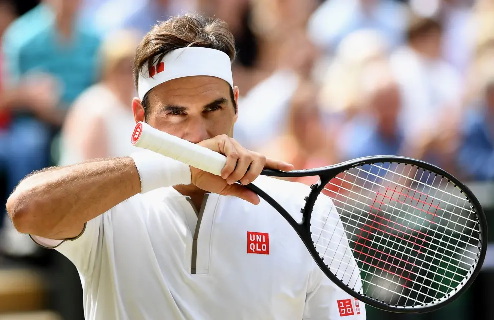 Wimbledon (United Kingdom), 14/07/2019.- Roger Federer of Switzerland in action against Novak Djokovic of Serbia during their Men's final match for the Wimbledon Championships at the All England Lawn Tennis Club, in London, Britain, 14 July 2019. (Tenis, Suiza, Reino Unido, Londres) EFE/EPA/ADRIAN DENNIS / POOL EDITORIAL USE ONLY/NO COMMERCIAL SALES Wimbledon Championships