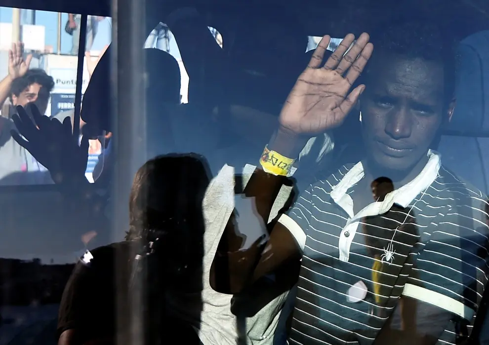 Minors who were among migrants stranded on the Spanish migrant rescue ship Open Arms are pictured after disembarking in Lampedusa, Italy August 17, 2019. REUTERS/Guglielmo Mangiapane [[[REUTERS VOCENTO]]] EUROPE-MIGRANTS/
