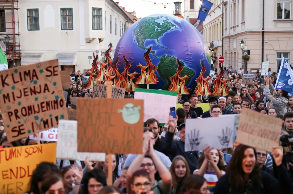 People hold banners as they march during climate change demonstration in Zagreb, Croatia, September 20, 2019. REUTERS/Antonio Bronic [[[REUTERS VOCENTO]]] CLIMATE-CHANGE/STRIKE-CROATIA