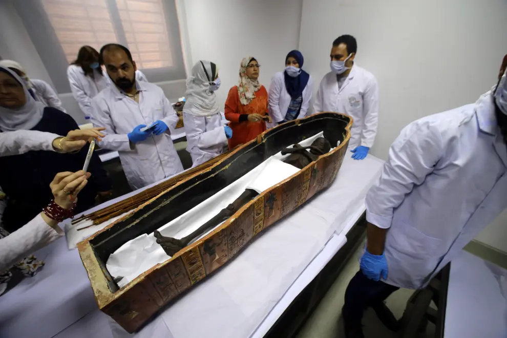 Cairo (Egypt), 21/09/2019.- Egyptian Minister of Antiquities Khaled El-Enany (2-L) attends the opening of the sarcophagi of the ancient Egyptian mummy of Sennedjem at the National Museum of Egyptian Civilization (NMEC) in Cairo, Egypt, 21 September 2019. It is said that Sennedjem was an overseer of workers at the Deir Al-Medina necropolis in Luxor some 3,400 years ago. The coffins of Sennedjem and his wife were previously exhibited at the Egyptian Museum in Tahrir among a funerary collection found inside his tomb discovered in 1886. Both coffins are painted anthropoid coffins. (Abierto, Egipto) EFE/EPA/KHALED ELFIQI Egyptian mummy of Sennedjem at National Museum of Egyptian Civilization