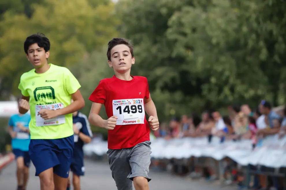 La Carrera de la Infancia de Zaragoza ha celebrado este domingo su decimocuarta edición con la participación de más de 1.100 niños en el Parque José Antonio Labordeta.