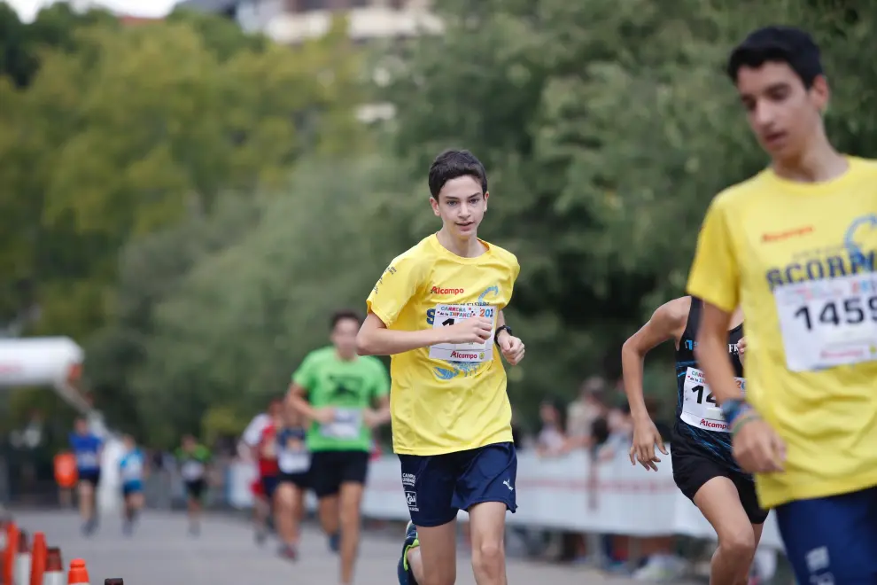 La Carrera de la Infancia de Zaragoza ha celebrado este domingo su decimocuarta edición con la participación de más de 1.100 niños en el Parque José Antonio Labordeta.