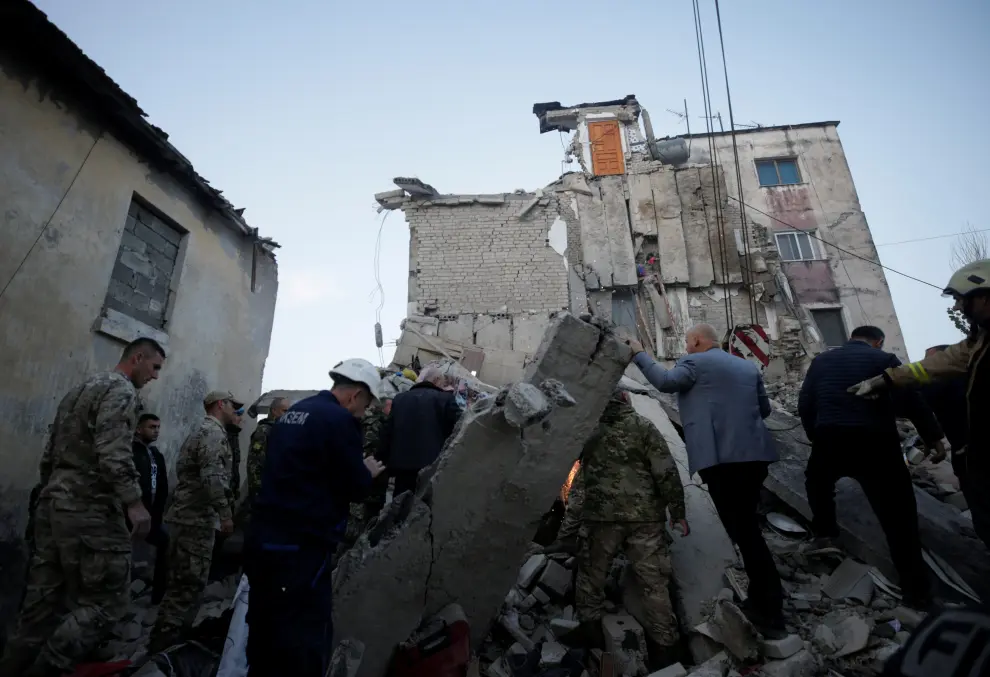 Emergency personnel walks in front of a damaged building in Thumane, after an earthquake shook Albania, November 26, 2019. REUTERS/Florian Goga [[[REUTERS VOCENTO]]] ALBANIA-QUAKE/