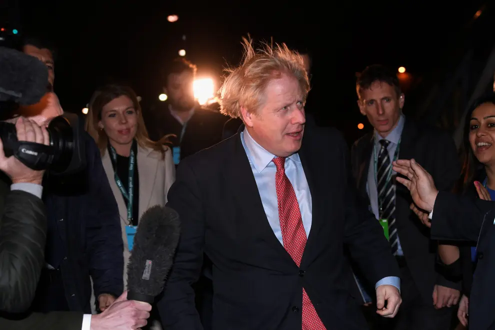 British Prime Minister Boris Johnson and Carrie Symonds arrives at the counting centre in Britain's general election in Uxbridge, Britain, December 13, 2019. REUTERS/Toby Melville [[[REUTERS VOCENTO]]] BRITAIN-ELECTION/