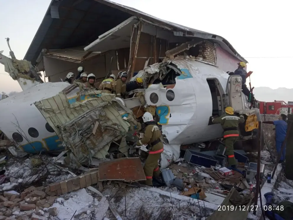 Emergency and security personnel are seen at the site of the plane crash near Almaty, Kazakhstan, December 27, 2019. Emergency Committee of Ministry of Internal Affairs of Kazakhstan/Handout via REUTERS ATTENTION EDITORS - THIS IMAGE WAS PROVIDED BY A THIRD PARTY. NO RESALES. NO ARCHIVES. PICTURE TIMESTAMP IS WATERMARKED FROM SOURCE [[[REUTERS VOCENTO]]]