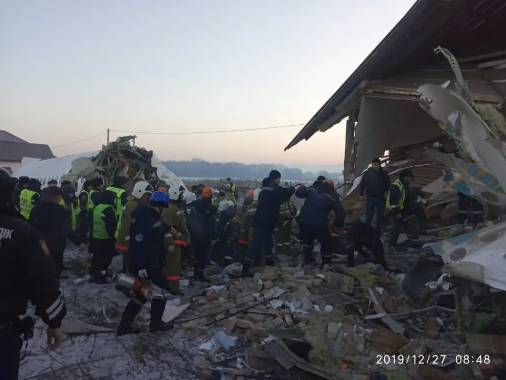Emergency and security personnel are seen at the site of the plane crash near Almaty, Kazakhstan, December 27, 2019. Emergency Committee of Ministry of Internal Affairs of Kazakhstan/Handout via REUTERS ATTENTION EDITORS - THIS IMAGE WAS PROVIDED BY A THIRD PARTY. NO RESALES. NO ARCHIVES. PICTURE TIMESTAMP IS WATERMARKED FROM SOURCE. [[[REUTERS VOCENTO]]]
