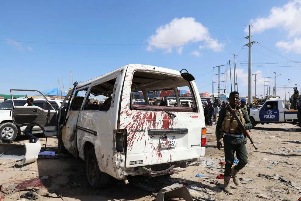 A Somali man stands at the scene of a car bomb explosion at a checkpoint in Mogadishu, Somalia  December 28, 2019. REUTERS/Feisal Omar [[[REUTERS VOCENTO]]] SOMALIA-BLAST/