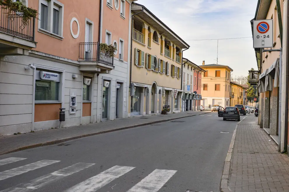 Castiglio Dadda (Italy), 21/02/2020.- A view of a deserted street in Castiglione d'Adda, near Lodi, northern Italy, 21 February 2020, where the mayor ordered the closure of municipal offices and the municipal library starting from 22 February. All recreational activities in the city have been interrupted on the day, media reported. The municipal waste collection center has been also closed. 'Considering the health emergency following the investigation of cases of coronavirus on the territory of Castiglione d'Adda and to protect the public safety', the mayor decided to close from 22 until 25 February also the schools of the city. 'All citizens of Castiglione d'Adda and Codogno are urged to stay at home as a precaution and avoid social contact,' is the invitation of the Councilor to the Welfare of Lombardy, after cases of the novel coronavirus have been reported in the area. (Italia) EFE/EPA/ANDREA FASANI Novel coronavirus, six infected in Lombardy, northern Italy