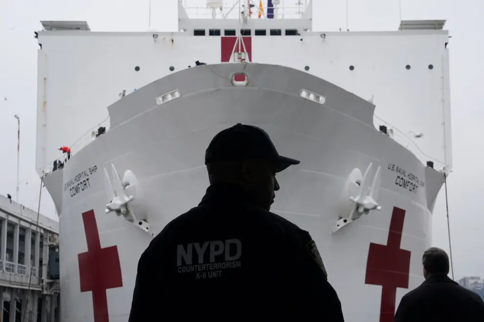 An NYPD officer is pictured as the USNS Comfort pulled into a berth in Manhattan during the outbreak of coronavirus disease (COVID-19), in the Manhattan borough of New York City