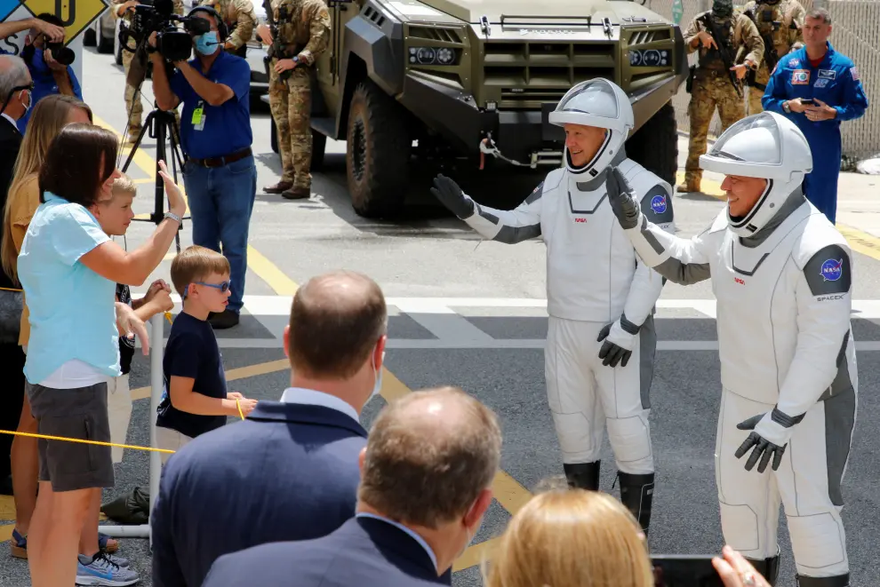 NASA astronauts Douglas Hurley and Robert Behnken greet their families before the launch of a SpaceX Falcon 9 rocket and Crew Dragon spacecraft at the Kennedy Space Center, in Cape Canaveral