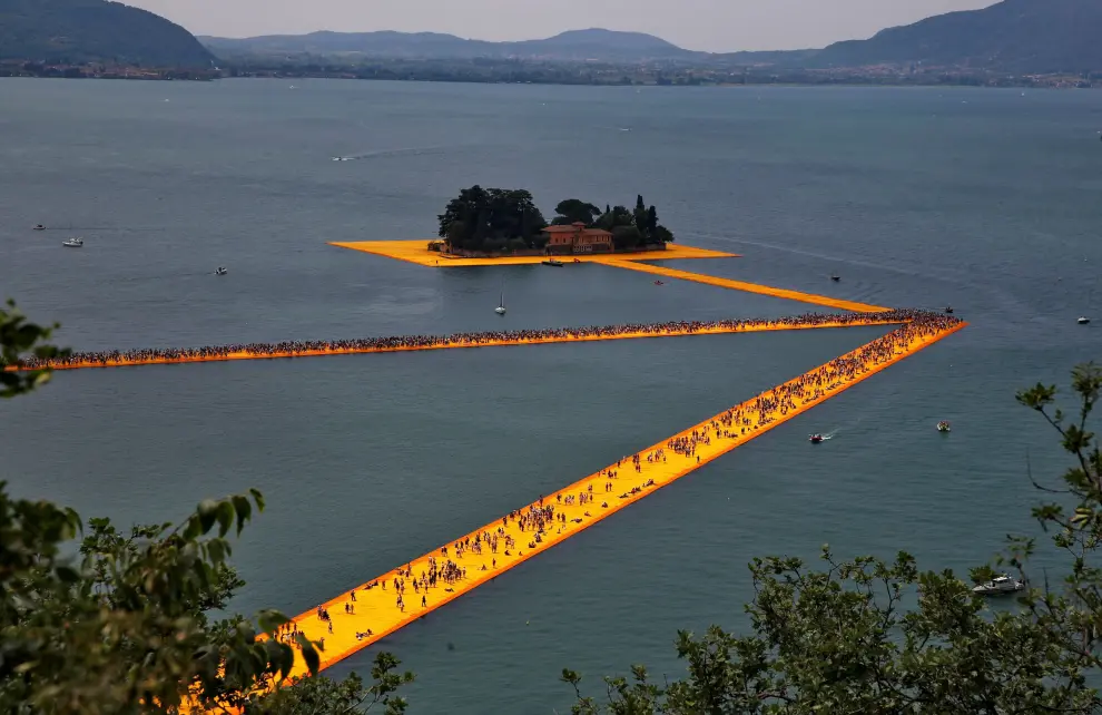 FILE PHOTO: People walk on the installation 'The Floating Piers' by Bulgarian-born artist Christo on Lake Iseo
