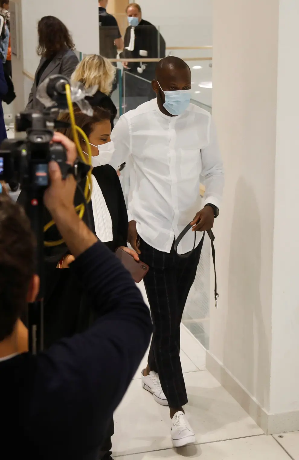 Lassana Bathily, who saved hostages during the attack of the Hyper Cacher kosher supermarket, wearing a protective face mask, arrives for the opening of the trial of the January 2015 Paris attacks against Charlie Hebdo satirical weekly, a policewoman in Montrouge and the Hyper Cacher kosher supermarket, at Paris courthouse, France, Steptember 2, 2020. The trial will take place from September 2 to November 10. REUTERS/Charles Platiau [[[REUTERS VOCENTO]]] FRANCE-CHARLIEHEBDO/TRIAL