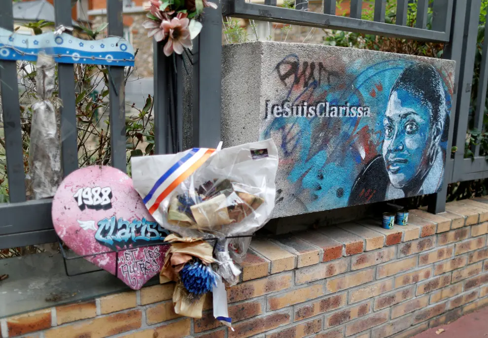 A man passes by a plaque in memory of the late policewoman Clarissa Jean-Philippe in Montrouge as Paris court prepares for the opening of the trial of the January 2015 Paris attacks against Charlie Hebdo satirical weekly magazine, a policewoman in Montrouge and the Hyper Cacher kosher supermarket, France, August 31, 2020. Picture taken August 31, 2020. REUTERS/Charles Platiau [[[REUTERS VOCENTO]]] FRANCE-CHARLIEHEBDO/TRIAL