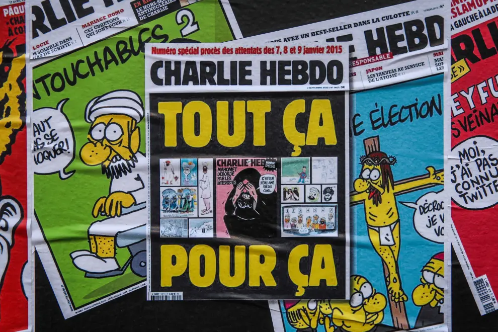 Paris (France), 02/09/2020.- Wall stickers depicting some covers of the French satirical weekly Charlie Hebdo including the cover of the issue the controversial cartoons of Prophet Muhammad published in 2012, are fixed next to the former office of Charlie Hebdo, in Paris, France, 02 September 2020. The Charlie Hebdo terror attack trial will be held from 02 September to 10 November 2020. The Charlie Hebdo terrorist attacks in Paris happened on 07 January 2015, with the storming of armed Islamist extremists of the satirical newspaper, starting three days of terror in the French capital. (Atentado, Terrorista, Francia) EFE/EPA/Mohammed Badra Start of Charlie Hebdo attack trial in Paris