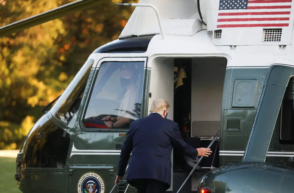U.S. President Trump boards the Marine One helicopter as he departs for Walter Reed Medical Center from the White House in Washington