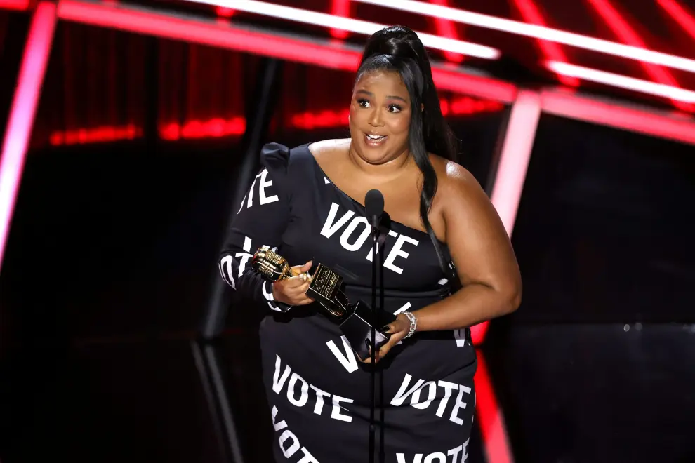 Lizzo accepts the Top Song Sales Artist award onstage for the 2020 Billboard Music Awards broadcast on October 14, 2020 at the Dolby Theatre in Los Angeles, California, U.S. Christopher Polk/NBC/Handout via REUTERS EDITORIAL USE ONLY. NO RESALES. NO ARCHIVES. THIS IMAGE HAS BEEN SUPPLIED BY A THIRD PARTY. MUST BE USED TOGETHER WITH COVERAGE OF 2020 BILLBOARD AWARDS BROADCAST. [[[REUTERS VOCENTO]]] AWARDS-BILLBOARD/