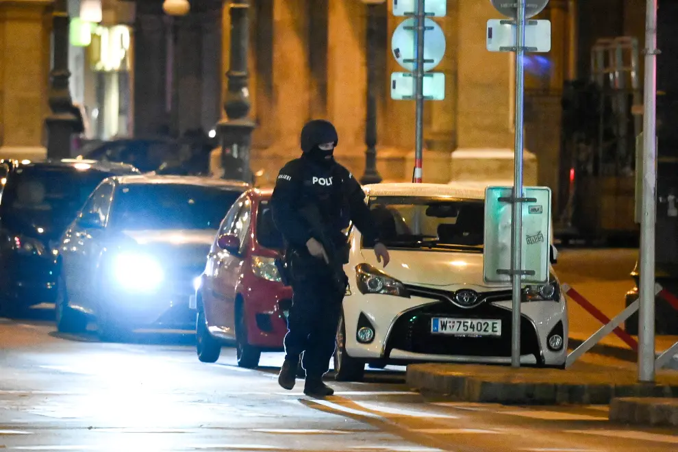 Vienna (Austria), 01/11/2020.- Austrian police men search two civilian infront of The Wiener Staatsoper (Vienna State Opera) after a shooting near the`Stadttempel`synagogue in Vienna, Austria, 02 November 2020. According to recent reports, at least one person is reported to have died and three are injured in what officials treat as a terror attack. (Atentado, Viena) EFE/EPA/CHRISTIAN BRUNA Vienna terror attack