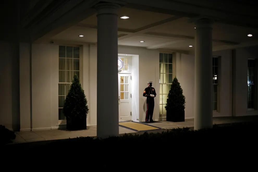 A U.S. Marine is seen posted at the West Wing door in Washington