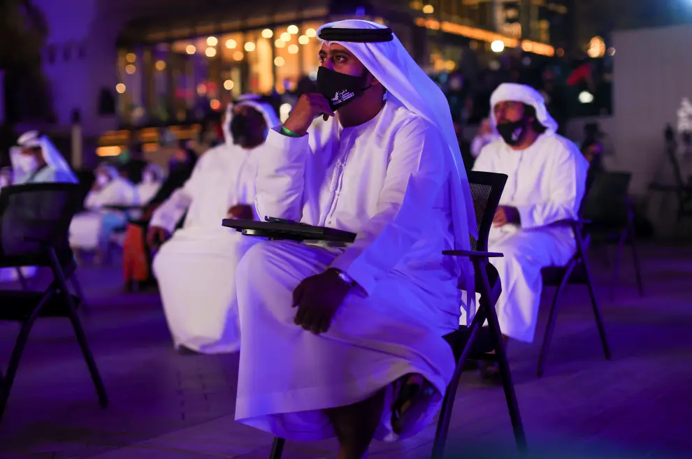 News reporters talk during an event to mark Hope Probe's entering the orbit of Mars, in Dubai, United Arab Emirates, February 9, 2021. REUTERS/Christopher Pike[[[REUTERS VOCENTO]]] EMIRATES-MARS/