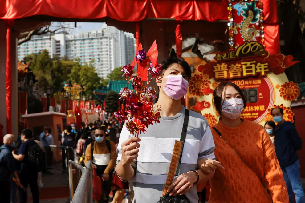 Worshippers wearing face masks visit Wong Tai Sin Temple at the first day of Chinese Lunar New Year, following the coronavirus disease (COVID-19) outbreak, in Hong Kong