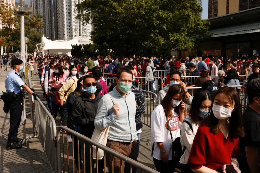 Worshippers wearing face masks visit Wong Tai Sin Temple at the first day of Chinese Lunar New Year, following the coronavirus disease (COVID-19) outbreak, in Hong Kong
