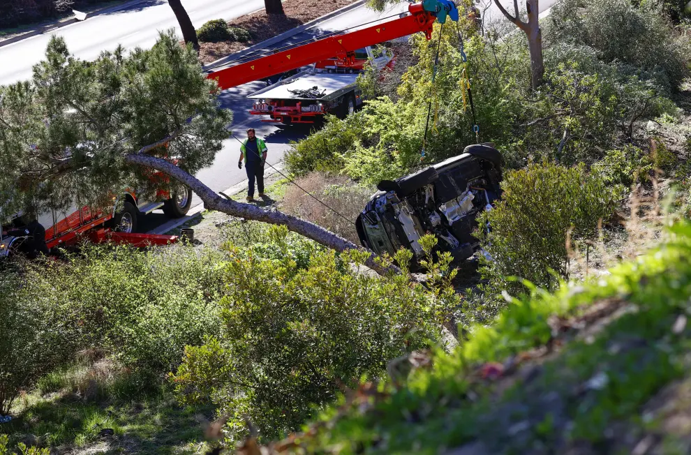 The overturned car of Tiger Woods is seen after he was involved in a car crash, near Los Angeles, California, U.S., February 23, 2021. REUTERS/Mario Anzuoni[[[REUTERS VOCENTO]]] PEOPLE-WOODS/