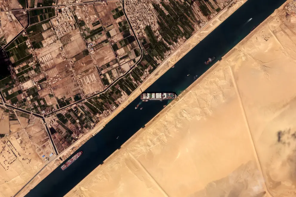 HANDOUT - 26 March 2021, Egypt, Suez: A satellite image provided by the European Space Imaging on 26 March 2021 shows the Ever HANDOUT - 26 March 2021, Egypt, Suez: A satellite image provided by the European Space Imaging on 26 March 2021 shows the "Ever Given", a container ship operated by the Evergreen Marine Corporation, is currently stuck in the Suez Canal. The state-run Suez