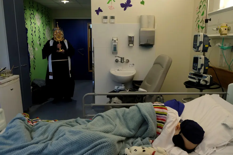 Rebecca Zammit Lupi, a 14-year-old cancer patient, bids farewell to her mother Marisa Ford in her room at Rainbow Ward in Sir Anthony Mamo Oncology Centre at Mater Dei Hospital, during the coronavirus disease (COVID-19) outbreak, in Tal-Qroqq, Malta, April 25, 2020. After seven weeks of lockdown in the ward because of the coronavirus, Marisa was able to go home for a couple of weeks' break, after her husband Reuters photographer Darrin Zammit Lupi was allowed to take over from her. When HEALTH-CORONAVIRUS/DAUGHTER-CANCER