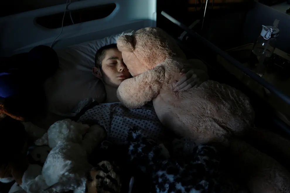Rebecca Zammit Lupi, a 15-year-old cancer patient, reacts after swallowing some medicine in her room in Rainbow Ward at Sir Anthony Mamo Oncology Centre in Mater Dei Hospital, during the coronavirus disease (COVID-19) outbreak, in Tal-Qroqq, Malta November 7, 2020. REUTERS/Darrin Zammit Lupi     SEARCH REBECCA HEALTH-CORONAVIRUS/DAUGHTER-CANCER