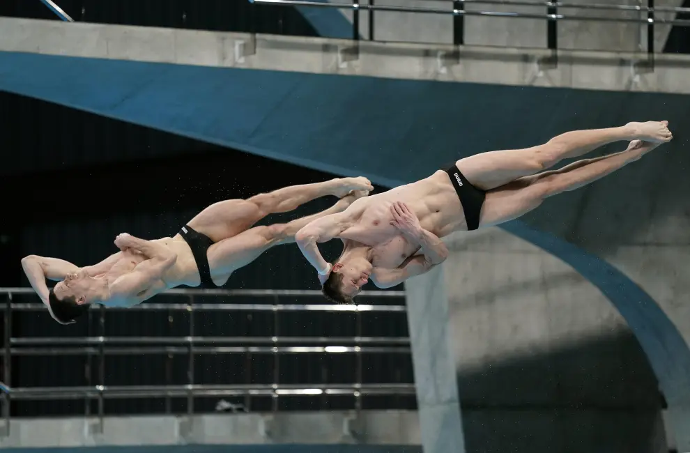 Diving - FINA Diving World Cup 2021 and Tokyo 2020 Olympics Aquatics Test Event - Tokyo Aquatics Centre, Tokyo, Japan - May 2, 2021 Poland's Andrzej Rzeszutek and Kacper Lesiak in action during the men's synchronised 3m springboard final REUTERS/Issei Kato[[[REUTERS VOCENTO]]] OLYMPICS-2020/TEST-AQUATICS