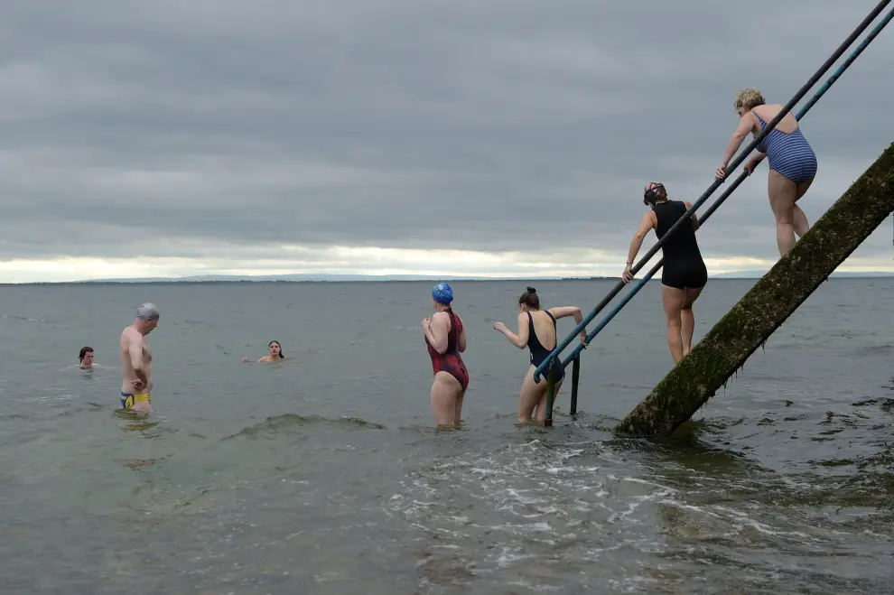 People swim on a cold day in Galway